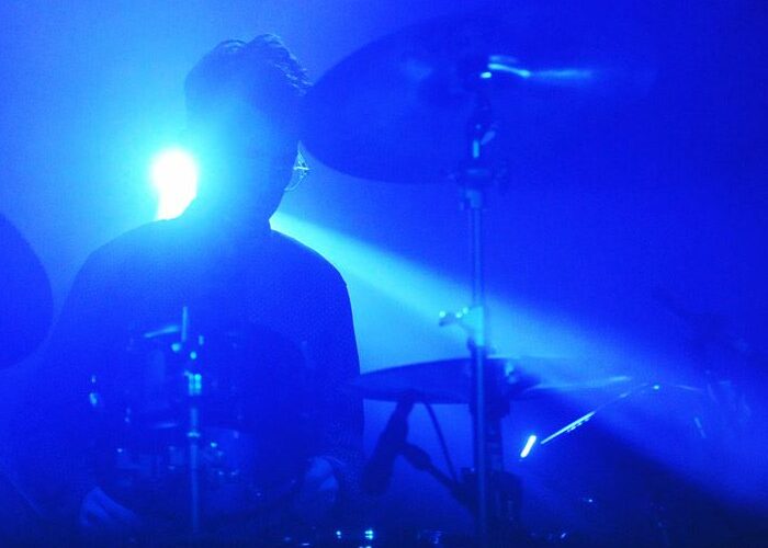 Drummer in blue back lighting